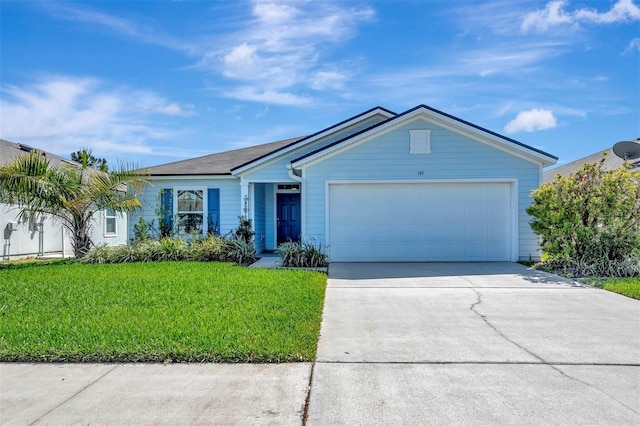 single story home featuring an attached garage, concrete driveway, and a front yard