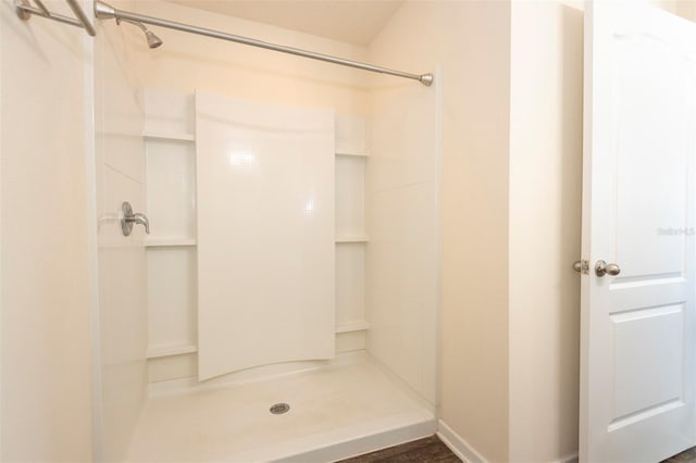 full bathroom featuring a shower stall