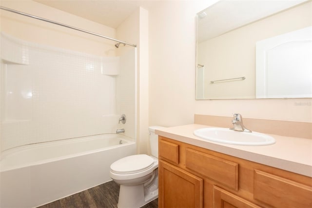 full bathroom with toilet, vanity, bathtub / shower combination, and wood finished floors