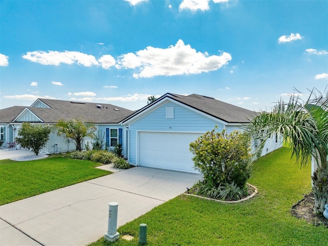 ranch-style home featuring a garage, concrete driveway, and a front lawn