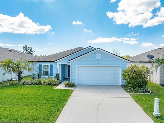 single story home featuring an attached garage, concrete driveway, and a front lawn