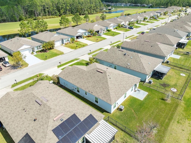 bird's eye view with a residential view and a water view