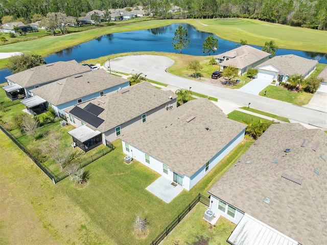 drone / aerial view with a residential view and a water view