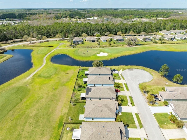 drone / aerial view with a residential view and a water view