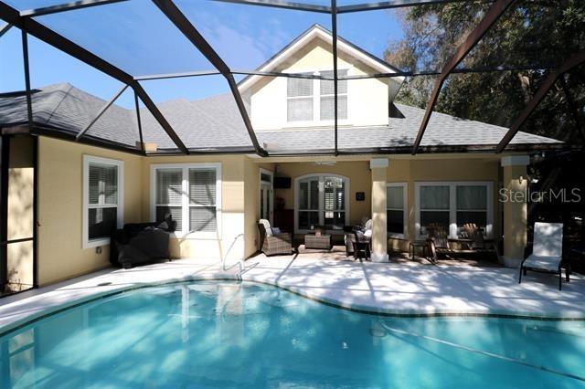 exterior space featuring an outdoor hangout area, a lanai, and a patio area