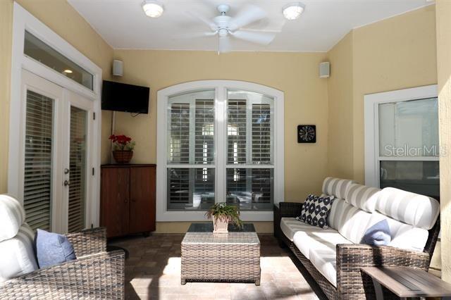 living area with a ceiling fan