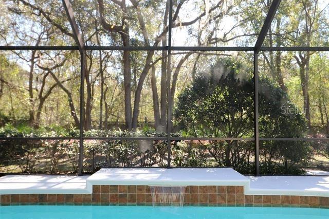 view of pool featuring a lanai