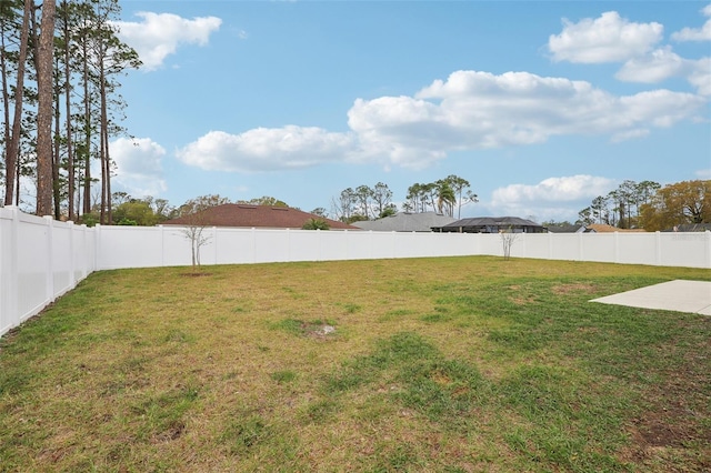 view of yard with a fenced backyard