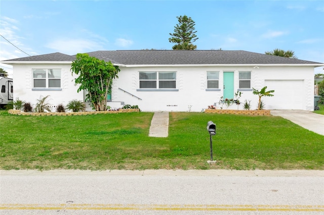 ranch-style home featuring a garage, driveway, a shingled roof, and a front yard