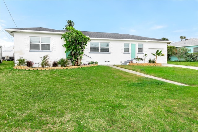 single story home with driveway, an attached garage, a front yard, and entry steps