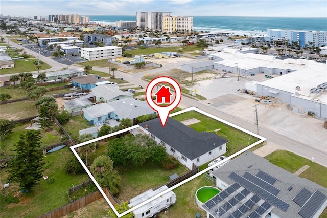 birds eye view of property featuring a view of city and a water view