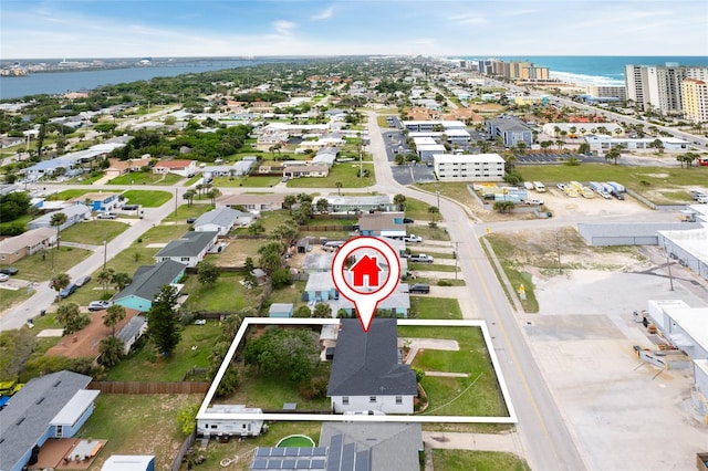 birds eye view of property featuring a view of city and a water view