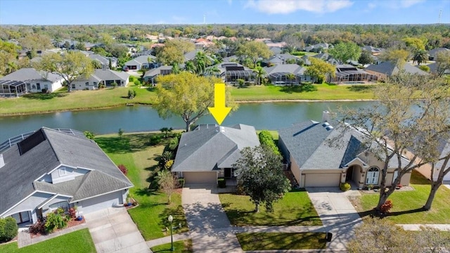 aerial view with a residential view and a water view