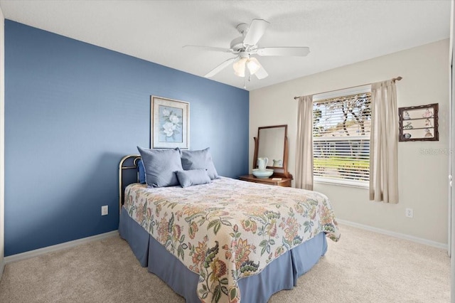 bedroom with carpet flooring, a ceiling fan, and baseboards