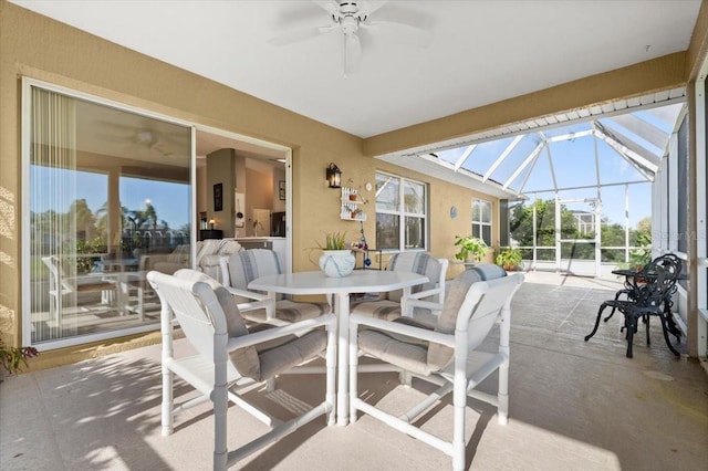 sunroom / solarium with a ceiling fan