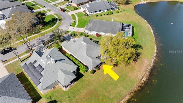 aerial view featuring a residential view and a water view