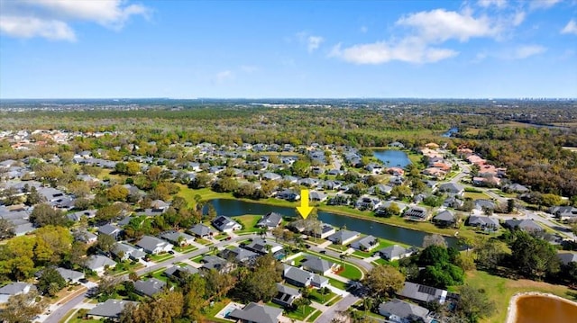 drone / aerial view with a residential view and a water view