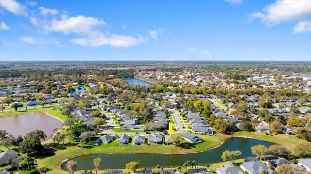 bird's eye view with a residential view and a water view