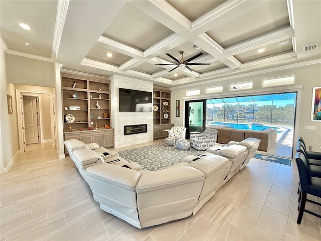 living room with a ceiling fan, visible vents, coffered ceiling, crown molding, and a large fireplace