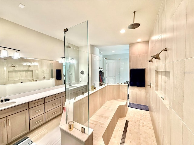 full bathroom featuring vanity, tile patterned floors, recessed lighting, and tiled shower