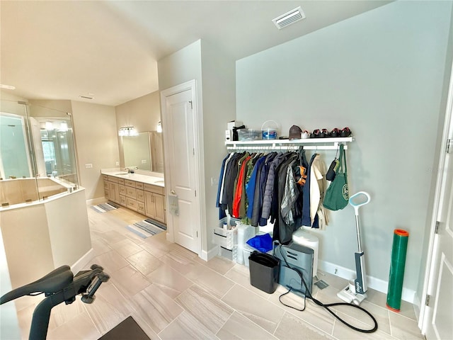 full bath featuring visible vents, baseboards, a stall shower, and vanity