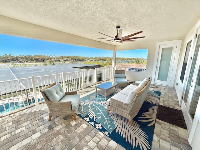 view of patio with a ceiling fan and outdoor lounge area