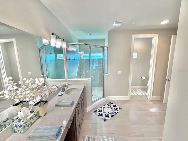 full bathroom featuring visible vents, a shower stall, baseboards, toilet, and vanity