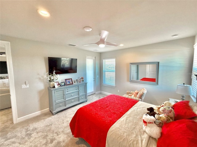 carpeted bedroom featuring a ceiling fan, recessed lighting, visible vents, and baseboards