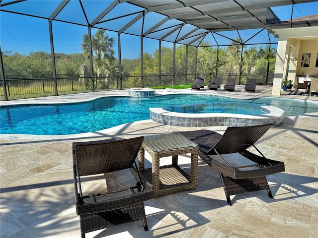 view of pool featuring glass enclosure, a patio area, and a pool with connected hot tub