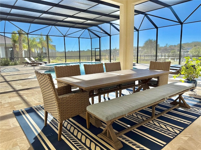 view of patio / terrace featuring a lanai, an outdoor hot tub, outdoor dining area, and an outdoor pool