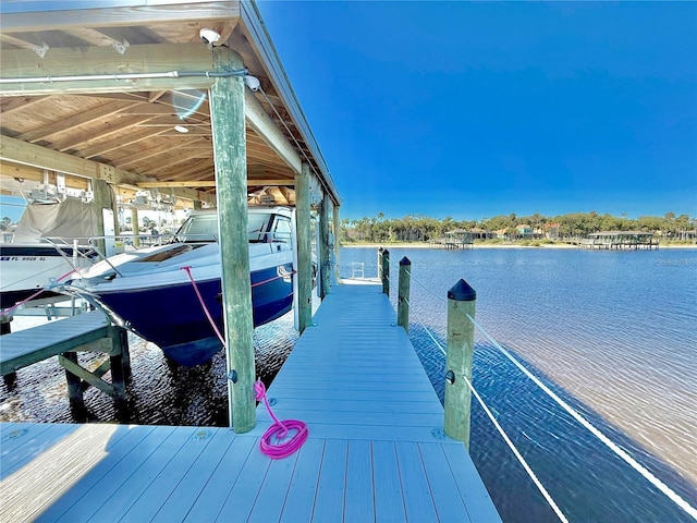 dock area featuring a water view and boat lift