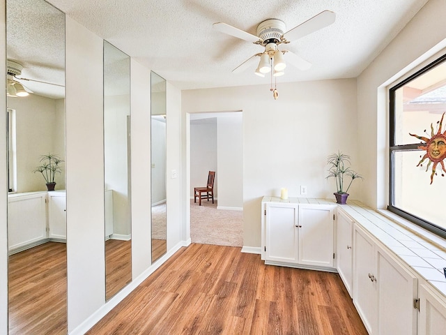 83 Farragut Dr, Palm Coast, FL 32137 - corridor featuring light wood-style flooring and a textured ceiling