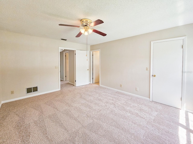 83 Farragut Dr, Palm Coast, FL 32137 - spare room featuring ceiling fan, light carpet, and a textured ceiling