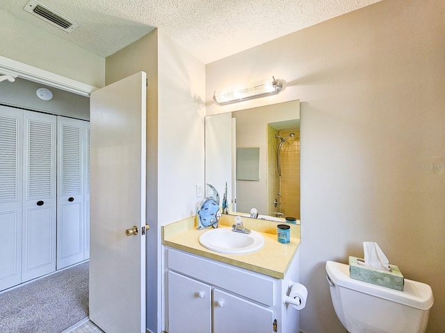 83 Farragut Dr, Palm Coast, FL 32137 - full bath with vanity, a textured ceiling, a closet, and a shower