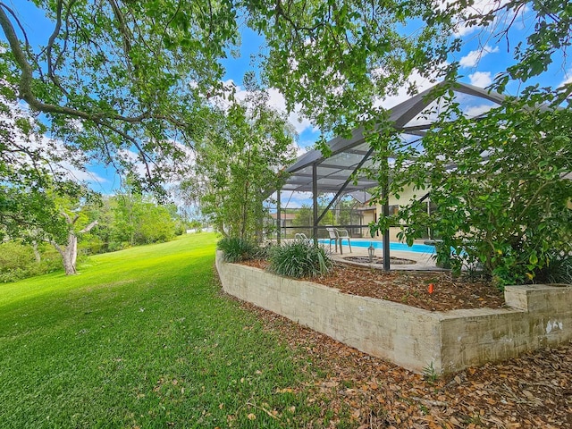 83 Farragut Dr, Palm Coast, FL 32137 - view of green lawn with an outdoor pool and a lanai