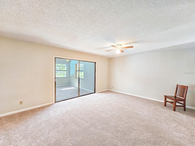 83 Farragut Dr, Palm Coast, FL 32137 - empty room featuring carpet flooring, a ceiling fan, and a textured ceiling