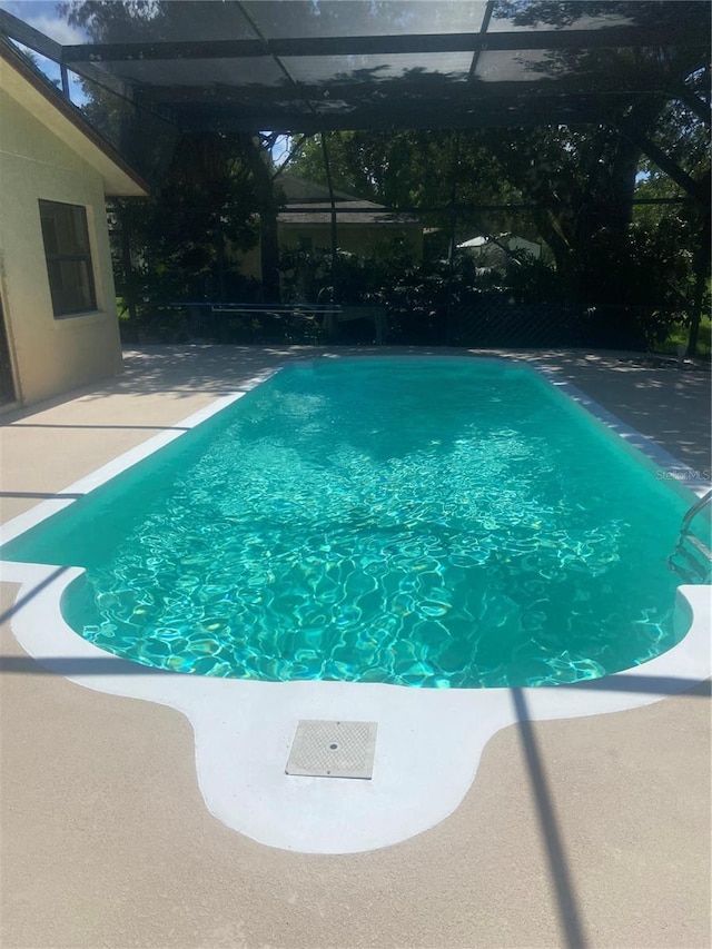 83 Farragut Dr, Palm Coast, FL 32137 - swimming pool with a patio and glass enclosure
