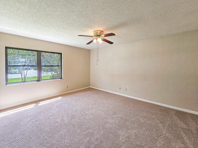 83 Farragut Dr, Palm Coast, FL 32137 - carpeted spare room featuring ceiling fan and a textured ceiling