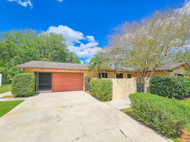 83 Farragut Dr, Palm Coast, FL 32137 - view of front of property with an attached garage, driveway, and stucco siding