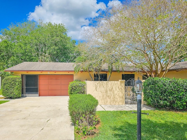 83 Farragut Dr, Palm Coast, FL 32137 - view of front facade with concrete driveway, stucco siding, and a garage