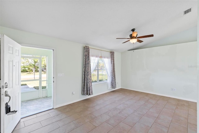 empty room featuring visible vents, ceiling fan, baseboards, and lofted ceiling