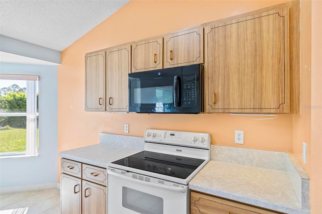 kitchen featuring black microwave, white range with electric cooktop, light countertops, vaulted ceiling, and a textured ceiling