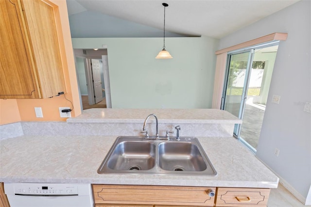 kitchen with pendant lighting, a sink, white dishwasher, light countertops, and vaulted ceiling