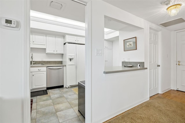 2970 Saint Johns Ave Unit 3F, Jacksonville, FL 32205 - kitchen with dishwasher, white cabinetry, white fridge with ice dispenser, and a sink