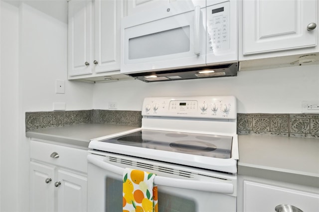 2970 Saint Johns Ave Unit 3F, Jacksonville, FL 32205 - kitchen featuring white appliances, light countertops, and white cabinetry