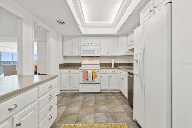 2970 Saint Johns Ave Unit 3F, Jacksonville, FL 32205 - kitchen featuring visible vents, white cabinets, white appliances, and a tray ceiling