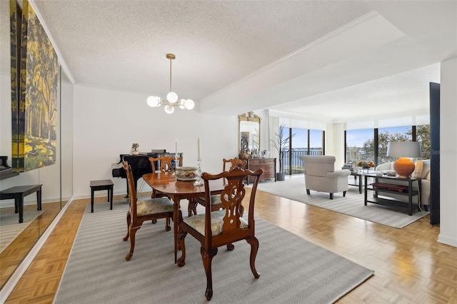 2970 Saint Johns Ave Unit 3F, Jacksonville, FL 32205 - dining space featuring baseboards, a textured ceiling, and a chandelier