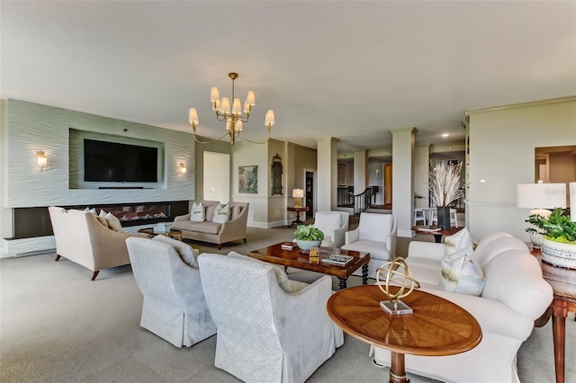 2970 Saint Johns Ave Unit 3F, Jacksonville, FL 32205 - living area featuring an inviting chandelier, decorative columns, and carpet floors