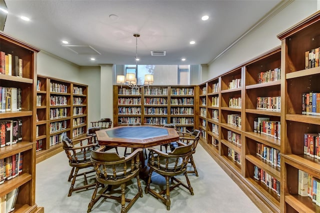 2970 Saint Johns Ave Unit 3F, Jacksonville, FL 32205 - sitting room with recessed lighting, wall of books, visible vents, and carpet floors