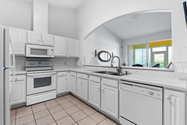 kitchen featuring a sink, white appliances, white cabinets, light countertops, and light tile patterned floors